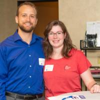 2 more pose at standing table